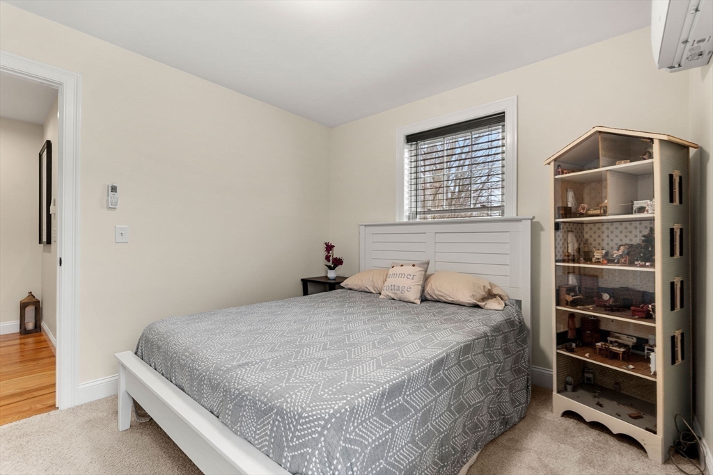 22 Pond Street, Unit 2 Amesbury, MA 01913 - Photo 23 of 40 a bedroom with a bed and a window