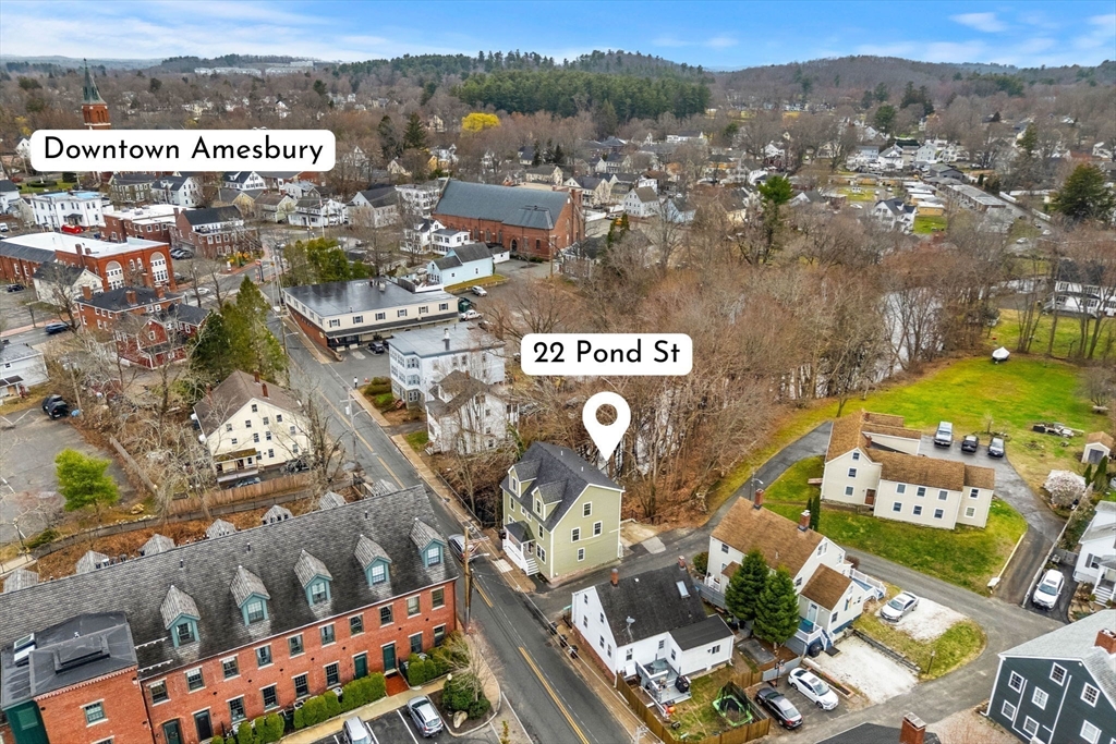 22 Pond Street, Unit 2 Amesbury, MA 01913 - Photo 3 of 40 an aerial view of residential houses with outdoor space