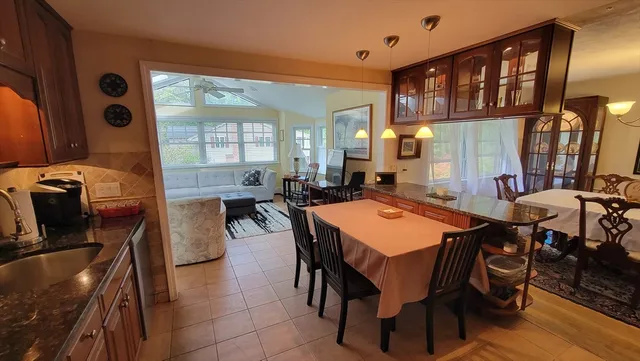 a view of a dining room with furniture and window