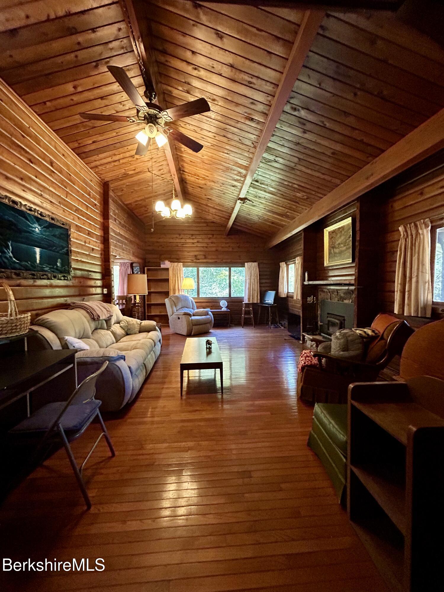 240 Kirchner Road Dalton, MA 01226 - Photo 11 of 36 a living room with furniture a pool table and a fireplace