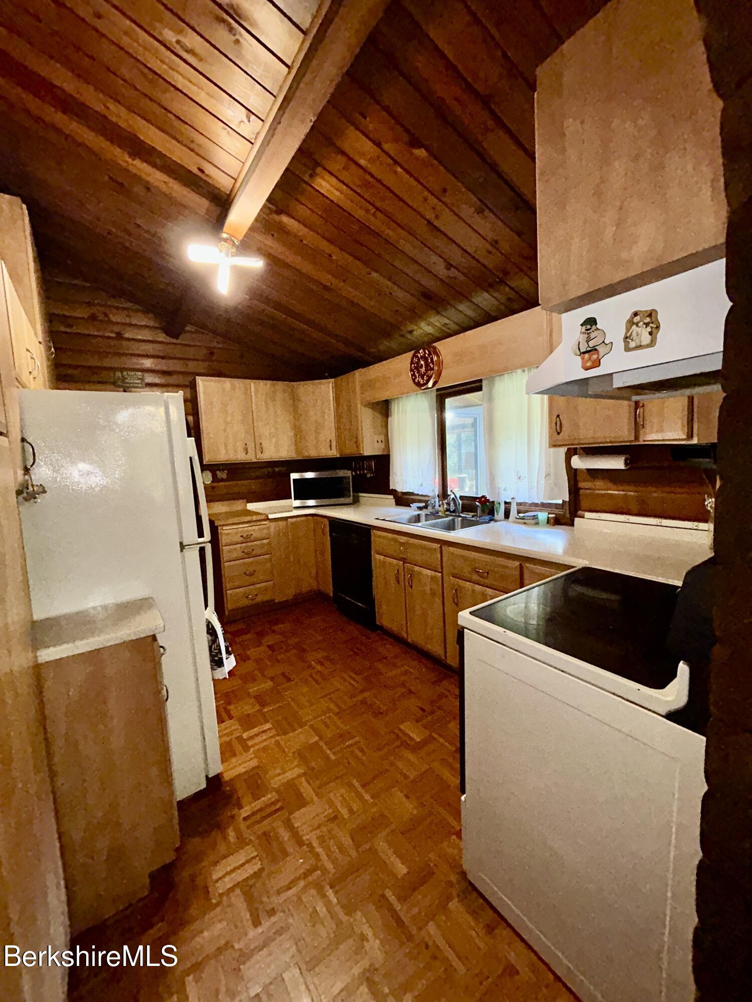 240 Kirchner Road Dalton, MA 01226 - Photo 15 of 36 a kitchen with stainless steel appliances granite countertop a stove a sink and a refrigerator