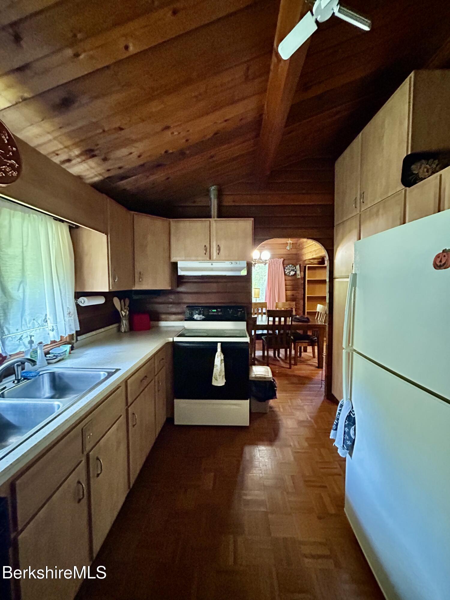 240 Kirchner Road Dalton, MA 01226 - Photo 18 of 36 a large kitchen with a large counter top stainless steel appliances and cabinets
