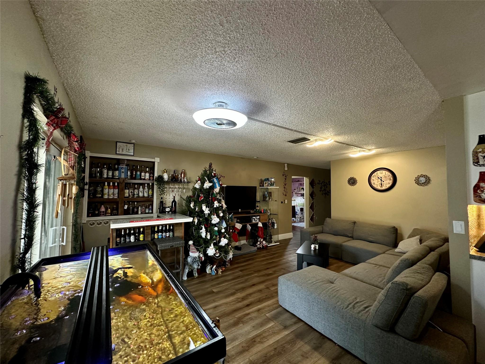 610 Southwest 76th Terrace North Lauderdale, FL 33068 - Photo 17 of 49 a living room with furniture and a flat screen tv