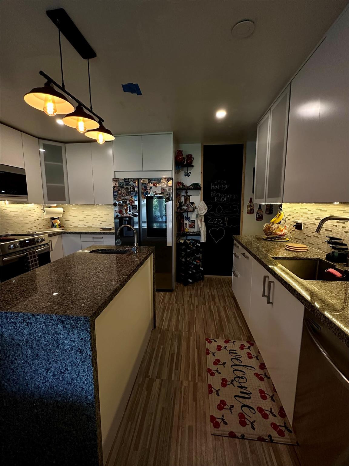 610 Southwest 76th Terrace North Lauderdale, FL 33068 - Photo 23 of 49 a kitchen with stainless steel appliances granite countertop a sink stove and cabinets