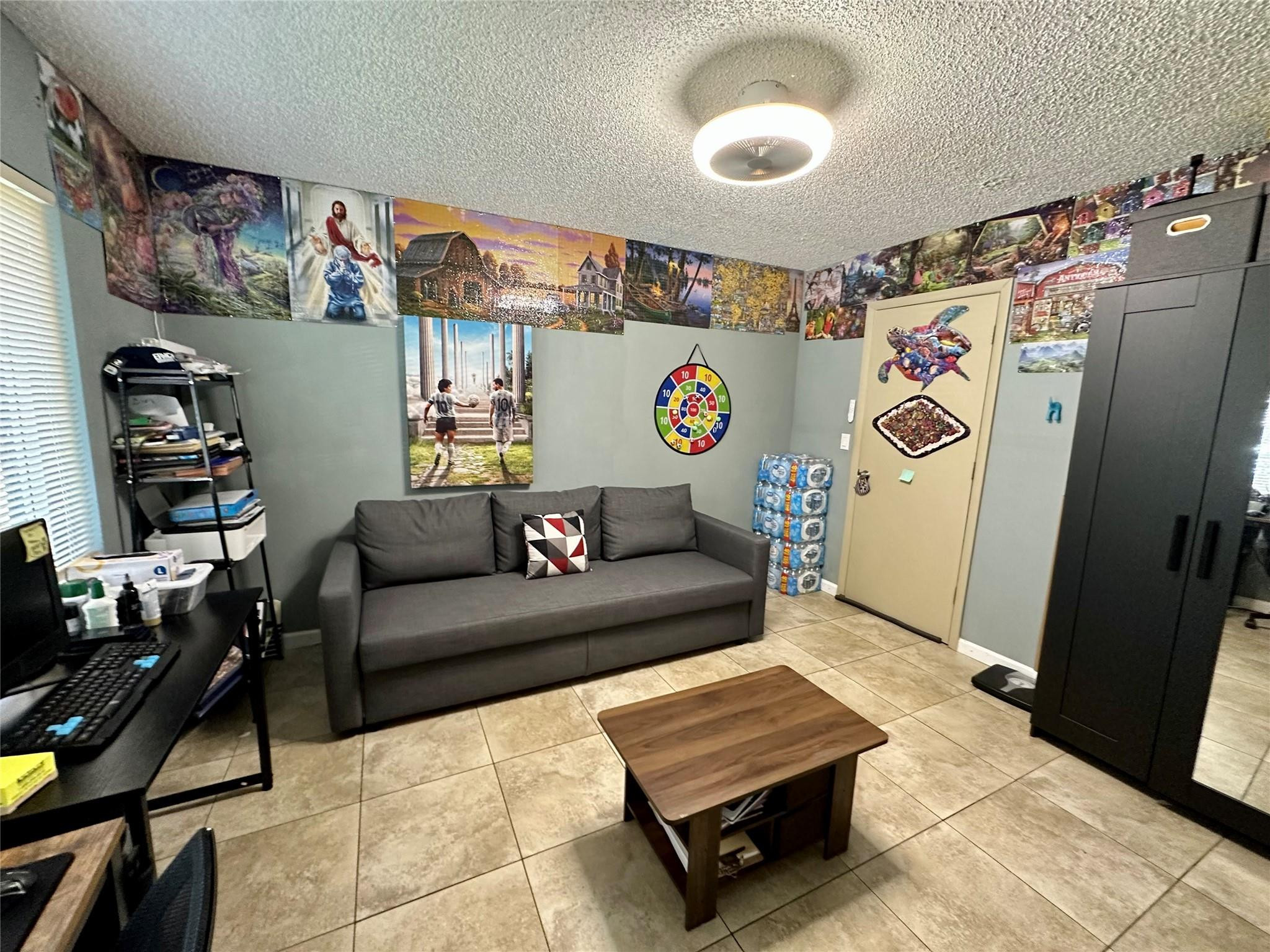610 Southwest 76th Terrace North Lauderdale, FL 33068 - Photo 30 of 49 a living room with a couch and a table in it