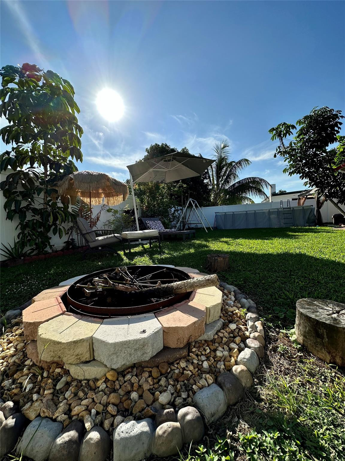 610 Southwest 76th Terrace North Lauderdale, FL 33068 - Photo 39 of 49 a view of a swimming pool with a yard and plants