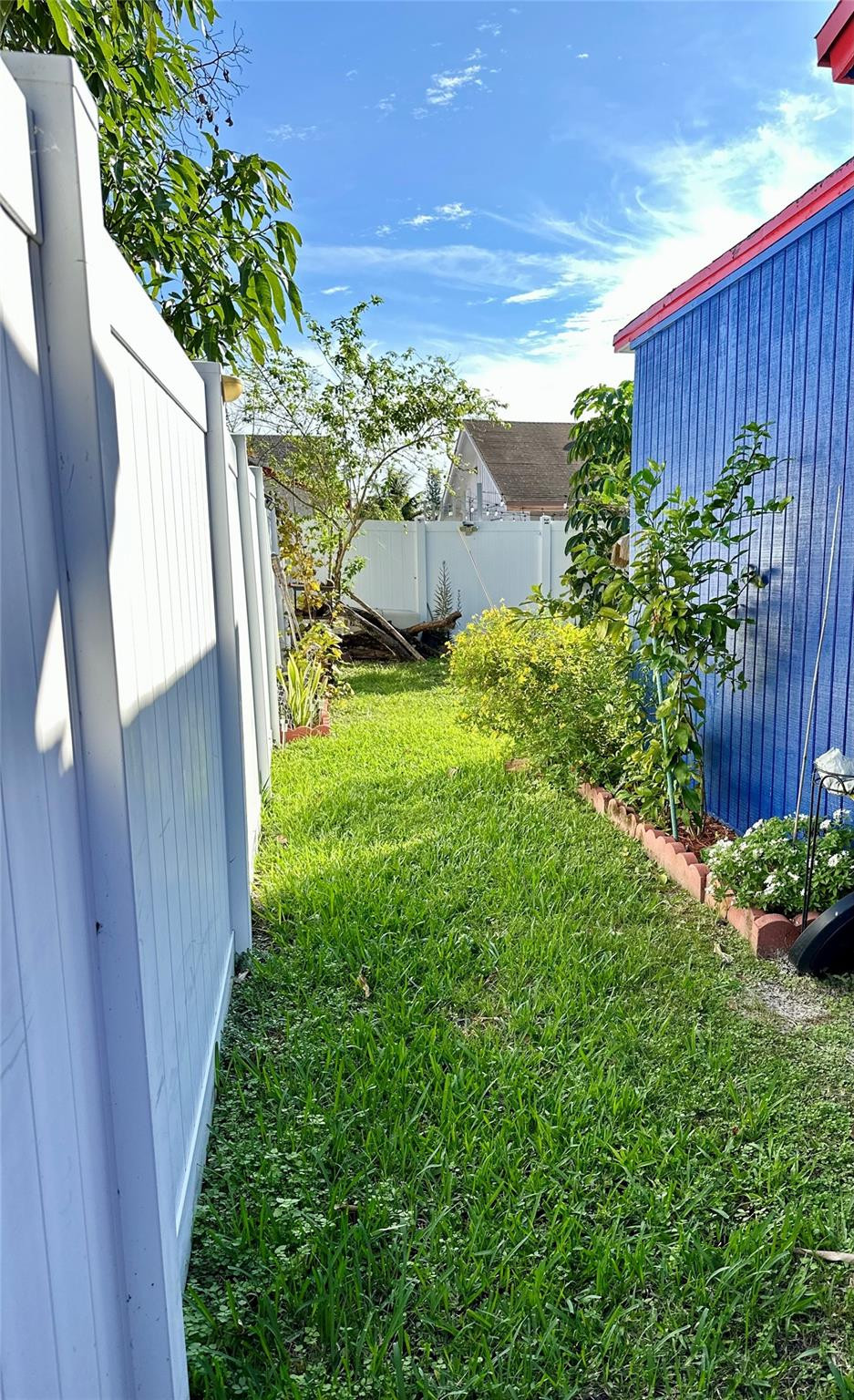 610 Southwest 76th Terrace North Lauderdale, FL 33068 - Photo 48 of 49 a view of a backyard with plants