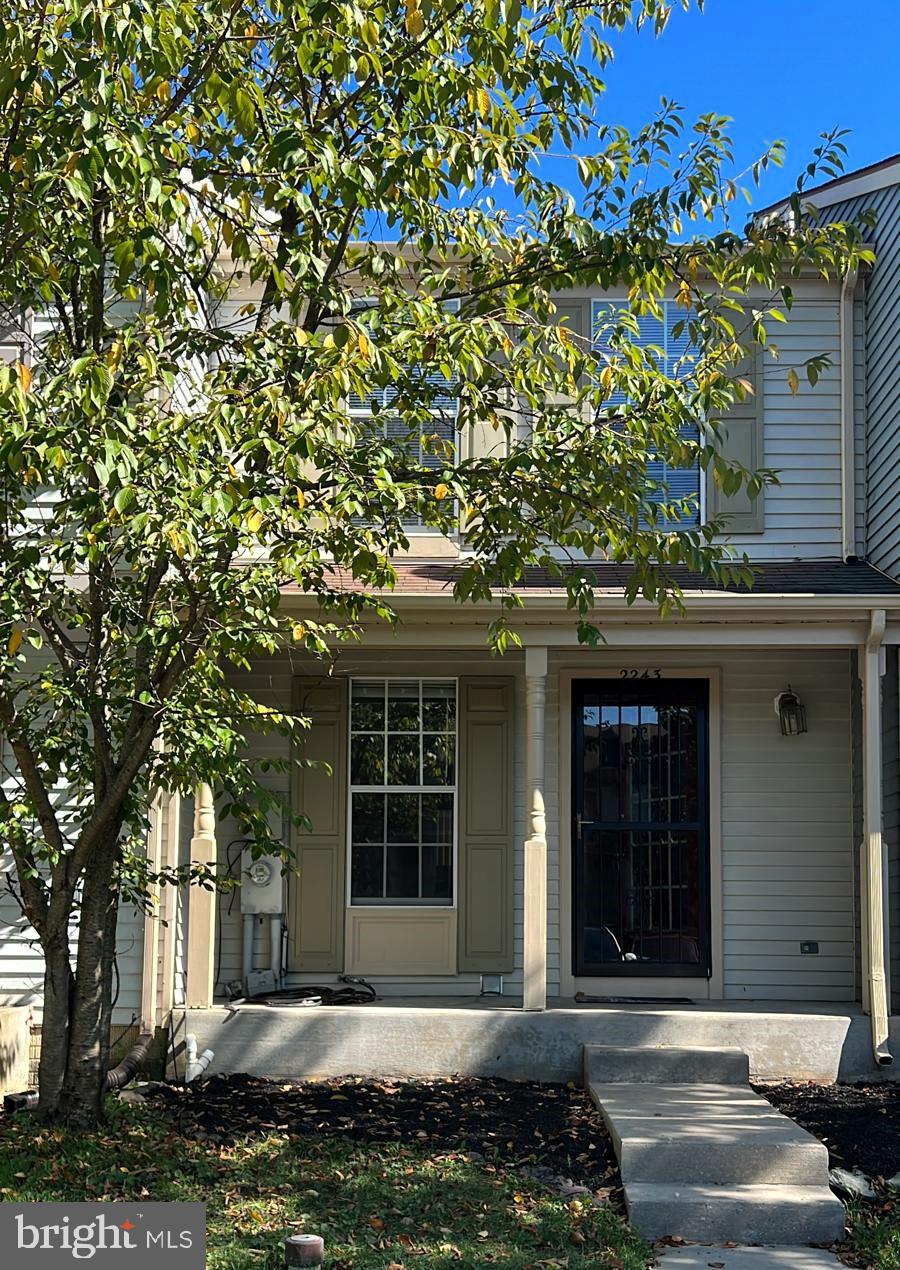 2243 Riding Crop Way Windsor Mill, MD 21244 - Photo 1 of 17 a front view of a house with a tree