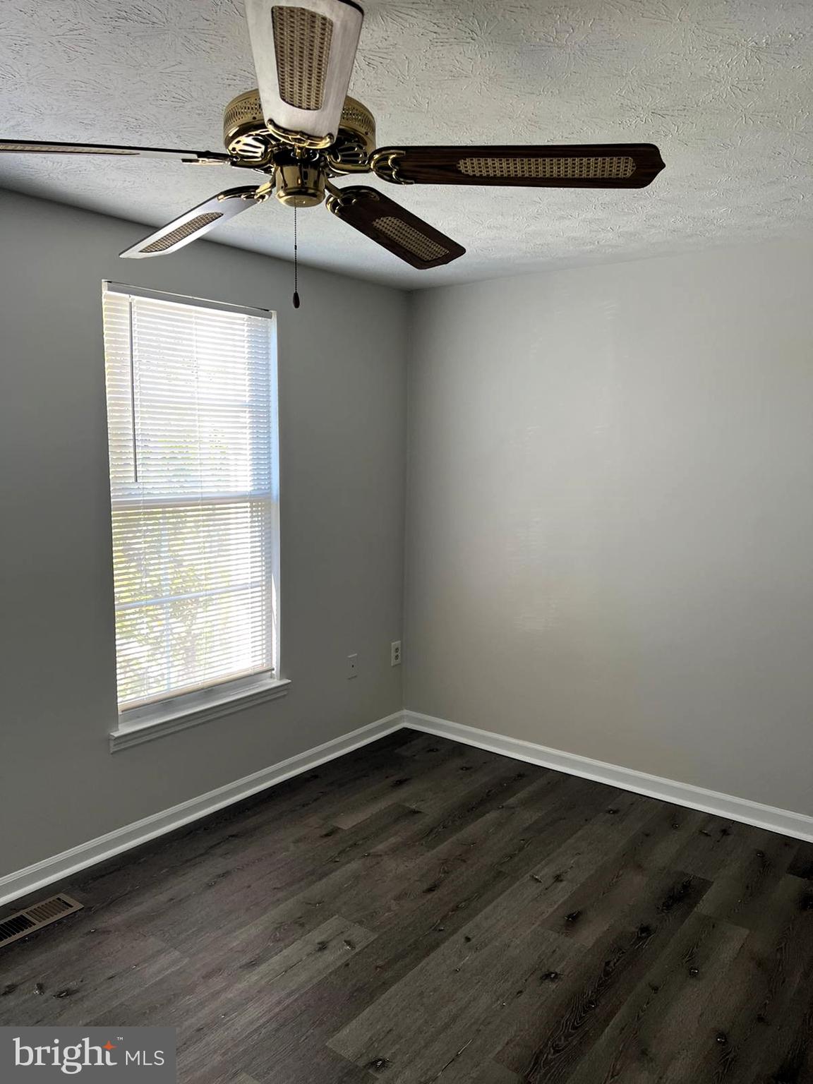 2243 Riding Crop Way Windsor Mill, MD 21244 - Photo 12 of 17 a view of a room with wooden floor and windows