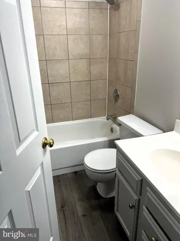 a bathroom with a toilet a sink and bathtub