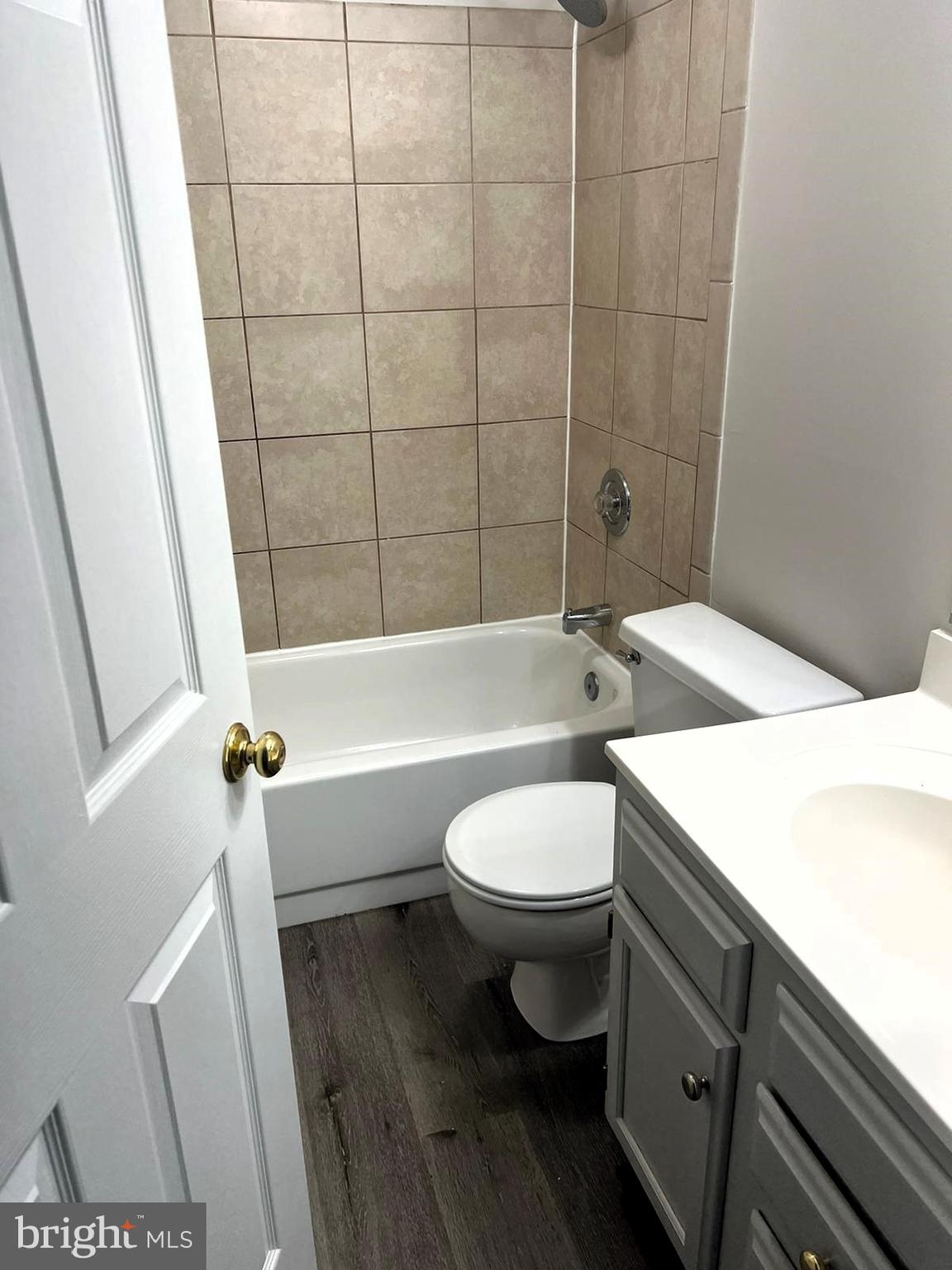 2243 Riding Crop Way Windsor Mill, MD 21244 - Photo 13 of 17 a bathroom with a toilet a sink and bathtub