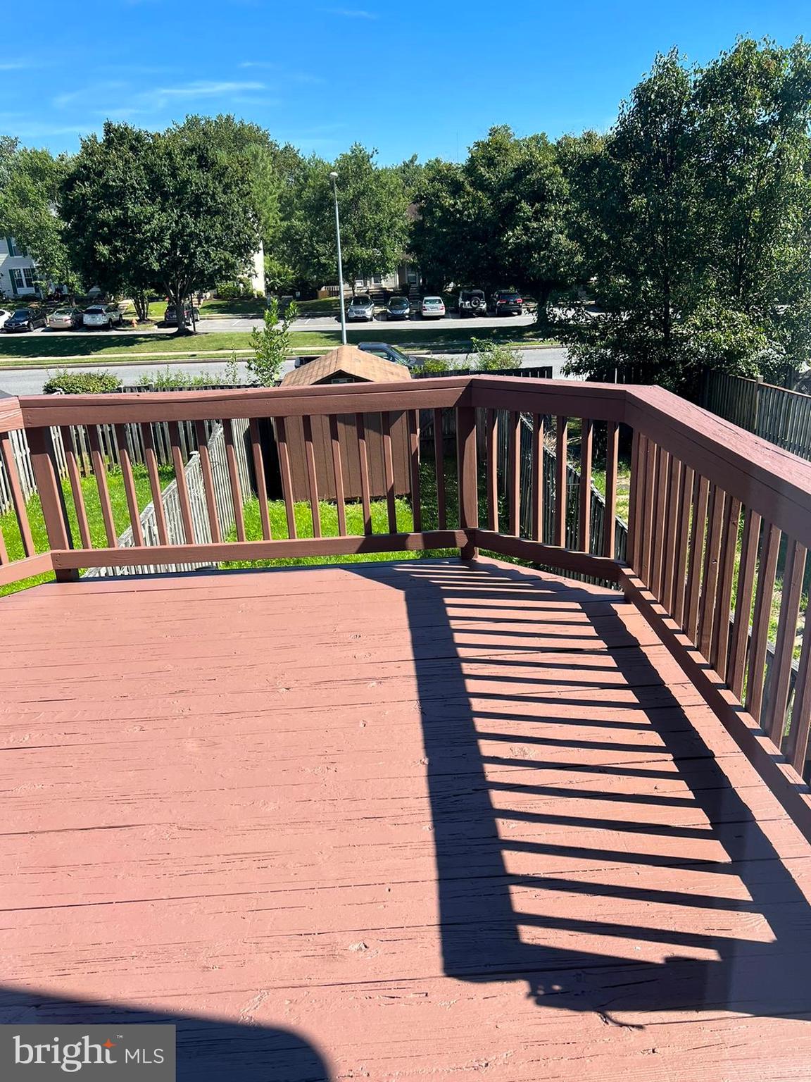 2243 Riding Crop Way Windsor Mill, MD 21244 - Photo 15 of 17 a view of a roof deck with wooden floor and fence