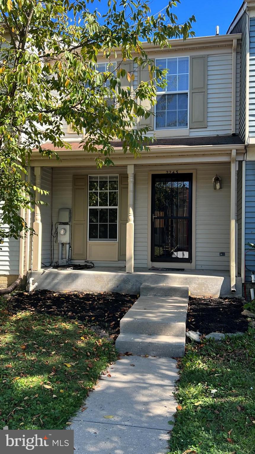 2243 Riding Crop Way Windsor Mill, MD 21244 - Photo 2 of 17 a front view of a house with garden