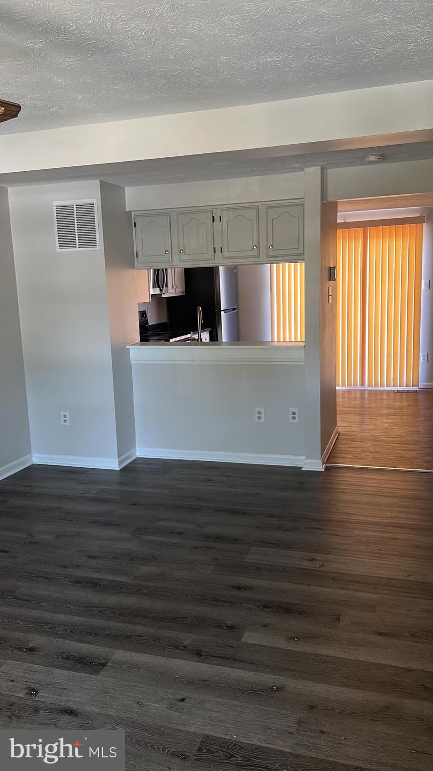 2243 Riding Crop Way Windsor Mill, MD 21244 - Photo 6 of 17 a view of kitchen and empty room