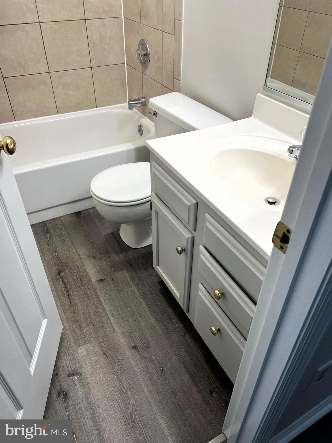 2243 Riding Crop Way Windsor Mill, MD 21244 - Photo 10 of 17 a bathroom with a sink a toilet and bathtub