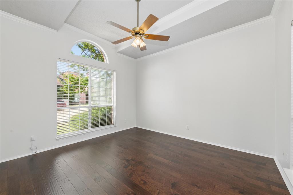 4202 Timberglen Road Dallas, TX 75287 - Photo 24 of 40 Spacious interior with dark wood-finish flooring, a tray ceiling, and crown molding