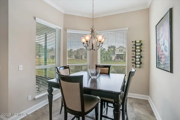 a view of a dining room with furniture window and outside view
