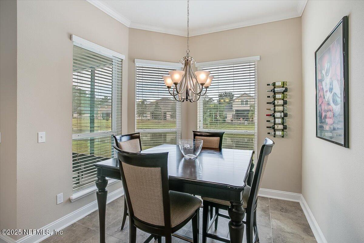 11780 Paddock Gates Drive Jacksonville, FL 32223 - Photo 16 of 39 a view of a dining room with furniture window and outside view