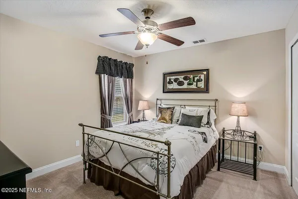 a bedroom with a bed and a table in it