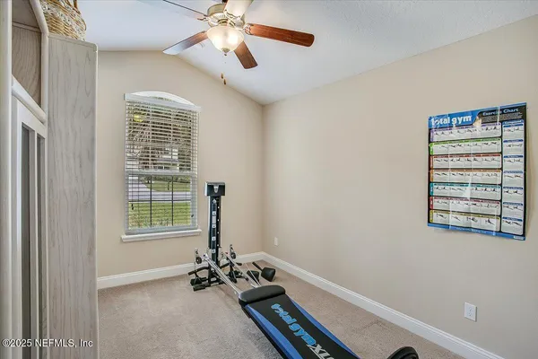 a bathroom with a sink vanity mirror and toilet