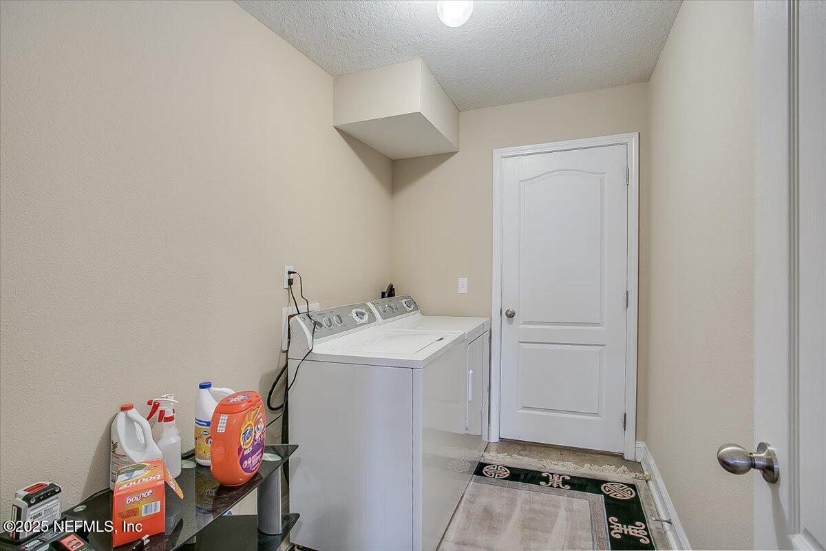 11780 Paddock Gates Drive Jacksonville, FL 32223 - Photo 29 of 39 a storage room with washer and dryer
