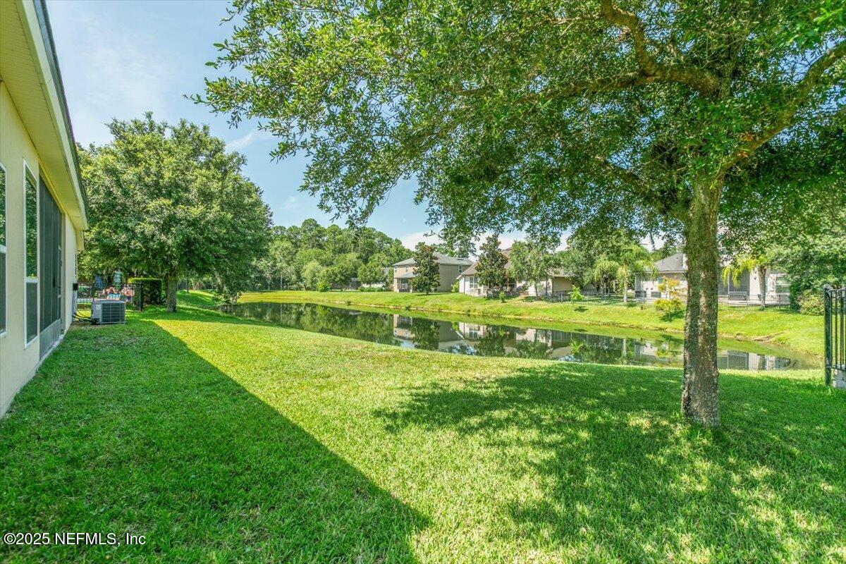 11780 Paddock Gates Drive Jacksonville, FL 32223 - Photo 32 of 39 a view of a golf course with a lake