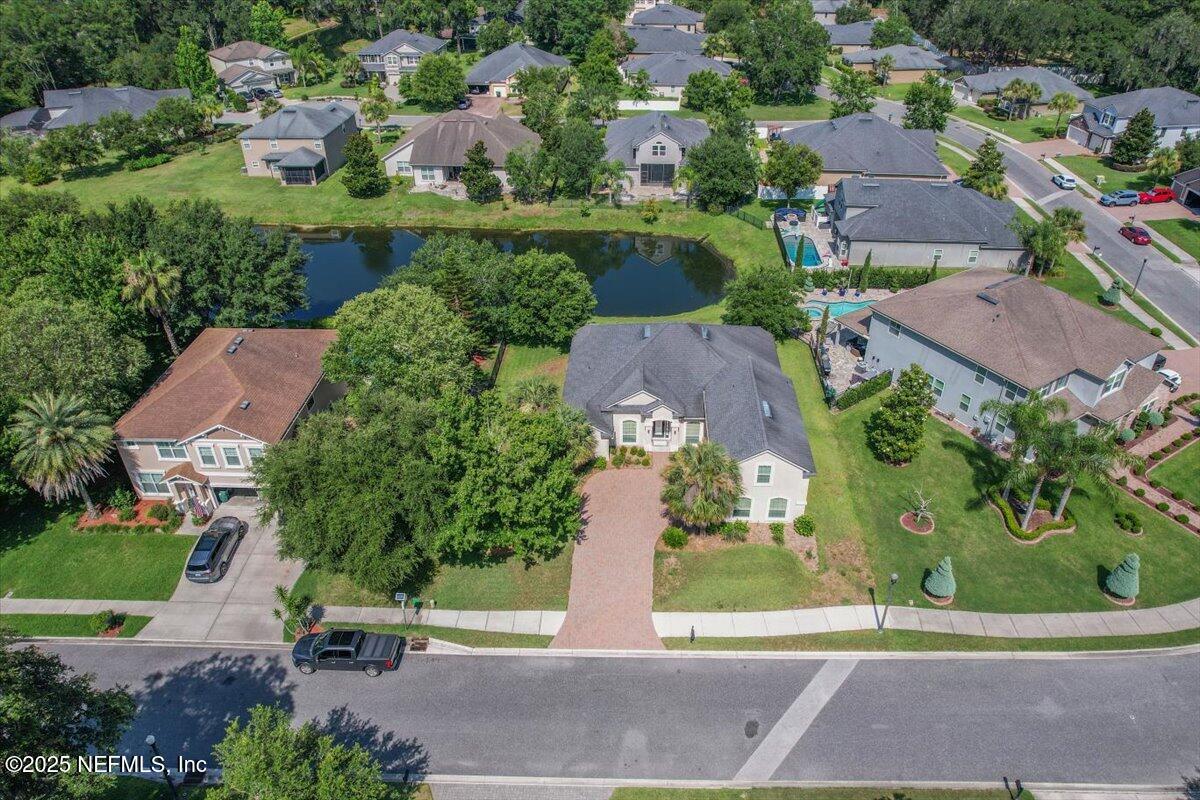11780 Paddock Gates Drive Jacksonville, FL 32223 - Photo 36 of 39 an aerial view of a house with a garden and yard