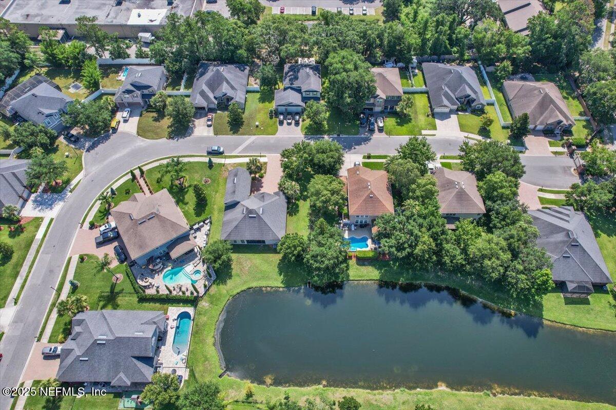 11780 Paddock Gates Drive Jacksonville, FL 32223 - Photo 37 of 39 an aerial view of a house with a garden and lake view
