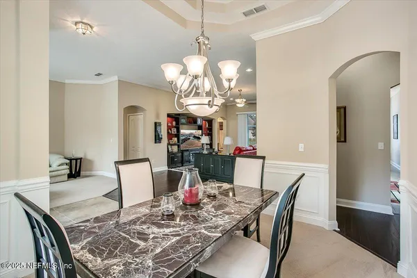 a view of a dining room with furniture
