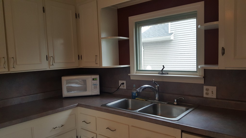 48 Agnes Street Springfield, MA 01118 - Photo 12 of 23 a kitchen with a sink and cabinets