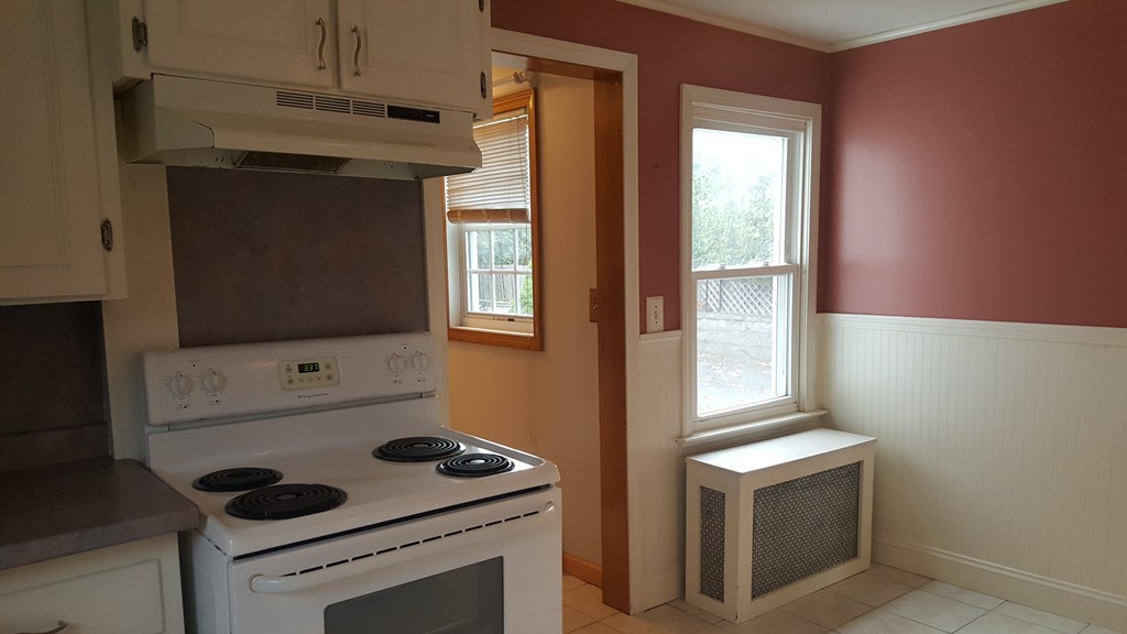 48 Agnes Street Springfield, MA 01118 - Photo 13 of 23 a kitchen with a stove and a microwave