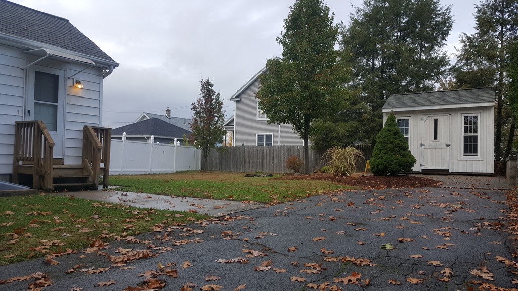 48 Agnes Street Springfield, MA 01118 - Photo 3 of 23 a view of a house with a yard