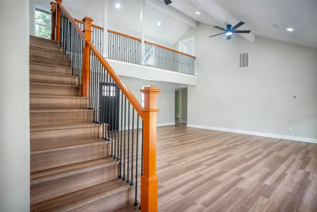 a kitchen with white cabinets and appliances