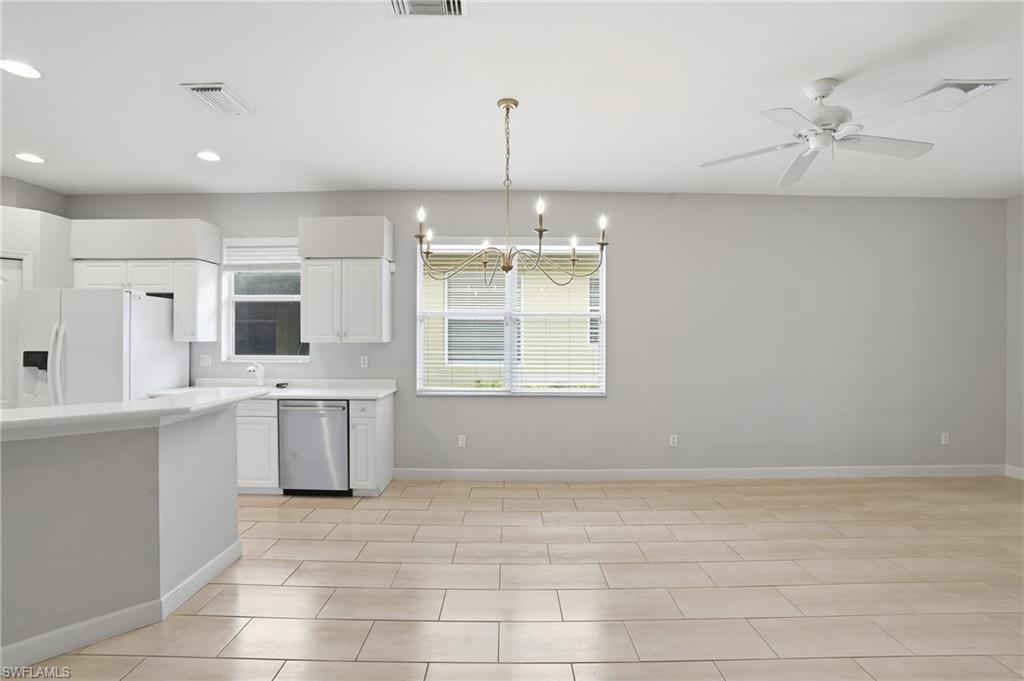 12517 Stone Valley Loop Fort Myers, FL 33913 - Photo 12 of 36 a view of a kitchen with microwave and cabinets