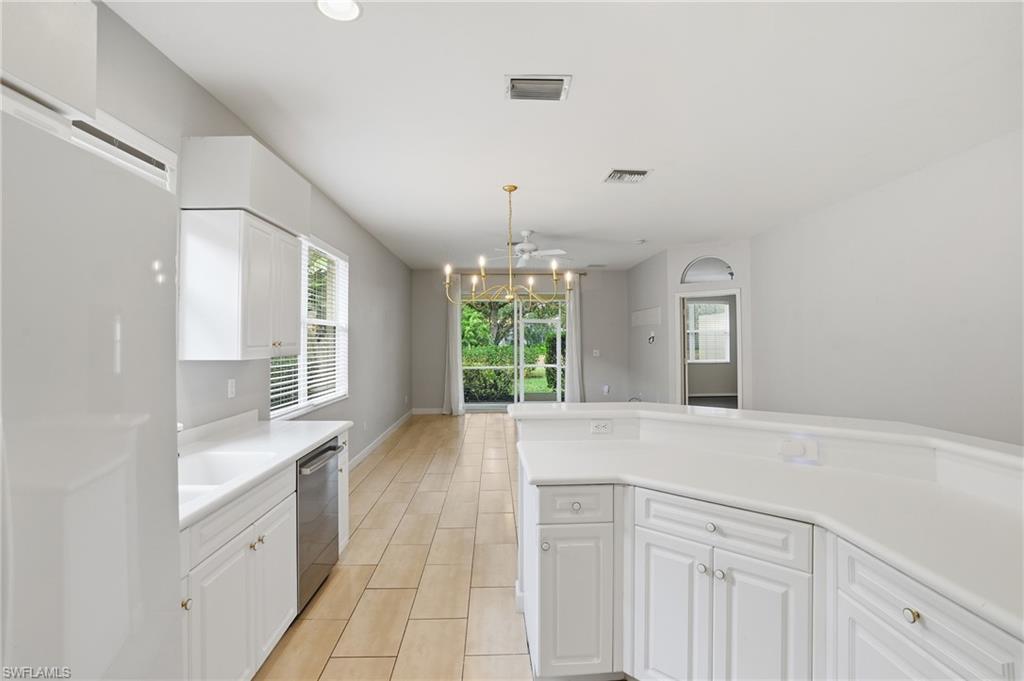 12517 Stone Valley Loop Fort Myers, FL 33913 - Photo 16 of 36 a view of a kitchen with a sink and windows