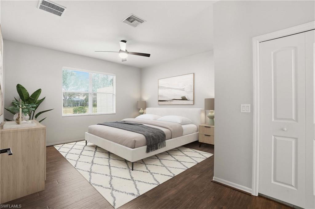 12517 Stone Valley Loop Fort Myers, FL 33913 - Photo 20 of 36 a bedroom with a large bed and a window