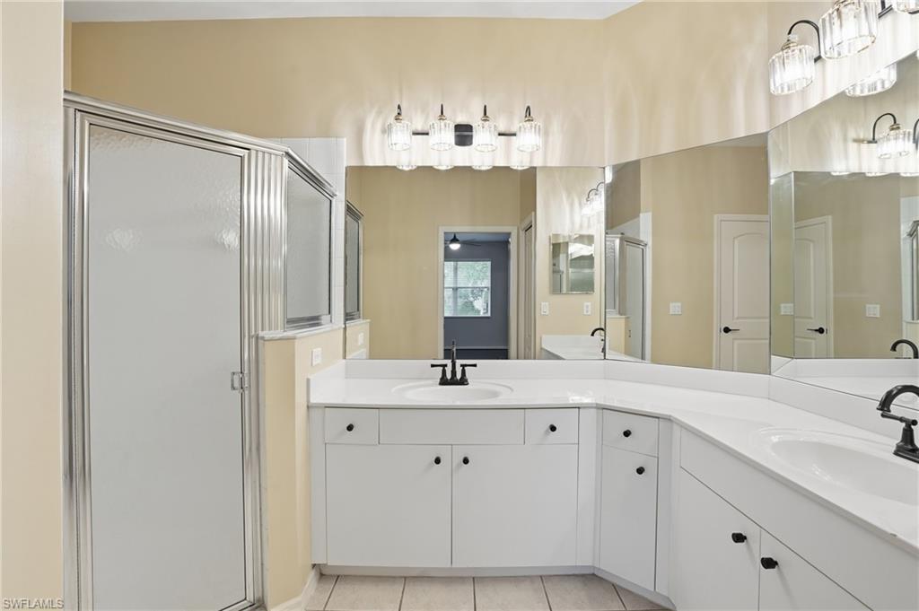 12517 Stone Valley Loop Fort Myers, FL 33913 - Photo 26 of 36 a bathroom with a sink double vanity and a mirror