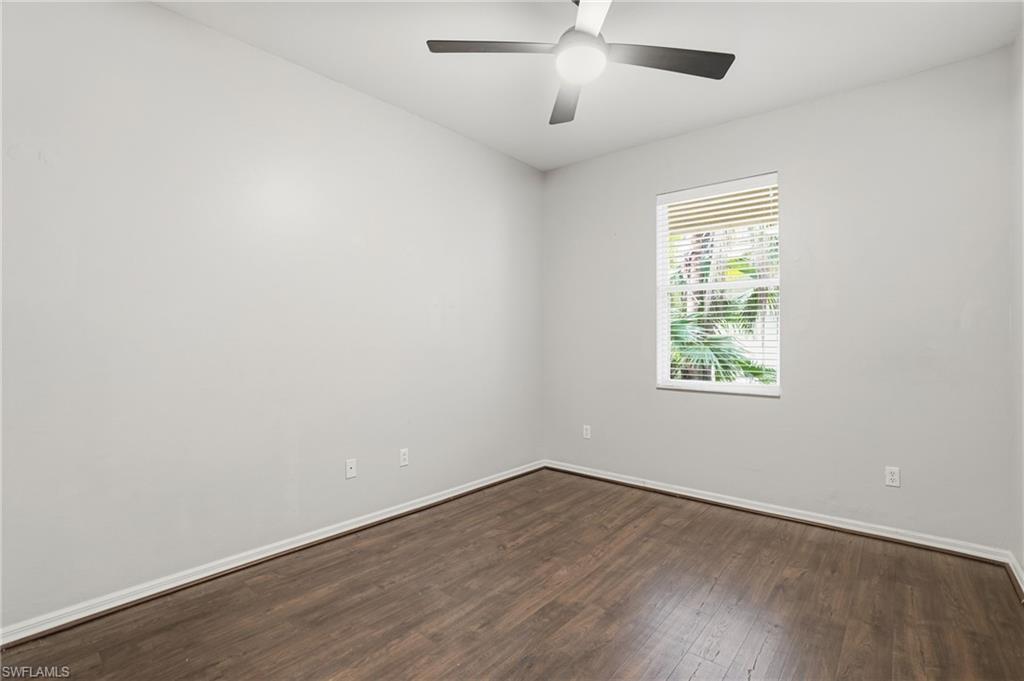 12517 Stone Valley Loop Fort Myers, FL 33913 - Photo 28 of 36 an empty room with wooden floor and windows