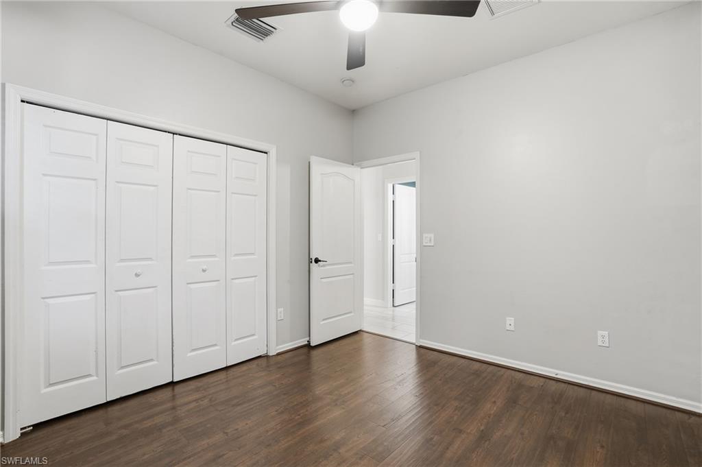 12517 Stone Valley Loop Fort Myers, FL 33913 - Photo 29 of 36 a view of an empty room with wooden floor