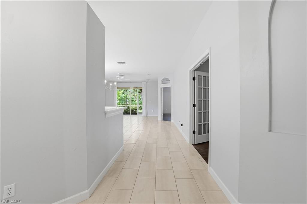 12517 Stone Valley Loop Fort Myers, FL 33913 - Photo 3 of 36 a view of a hallway with wooden floor
