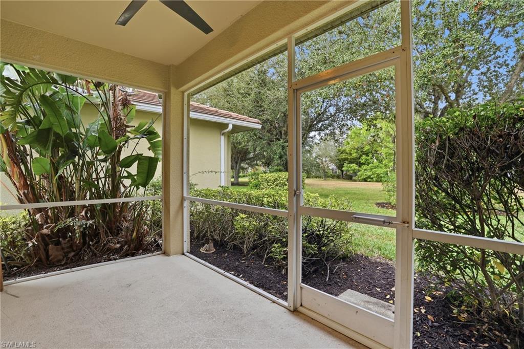 12517 Stone Valley Loop Fort Myers, FL 33913 - Photo 34 of 36 a view of a glass door and wooden floor