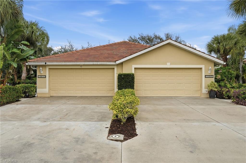 12517 Stone Valley Loop Fort Myers, FL 33913 - Photo 36 of 36 a front view of a house with a yard and garage