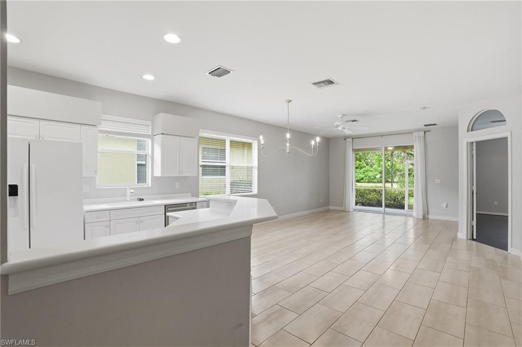 12517 Stone Valley Loop Fort Myers, FL 33913 - Photo 4 of 36 a view of a kitchen with a sink and windows