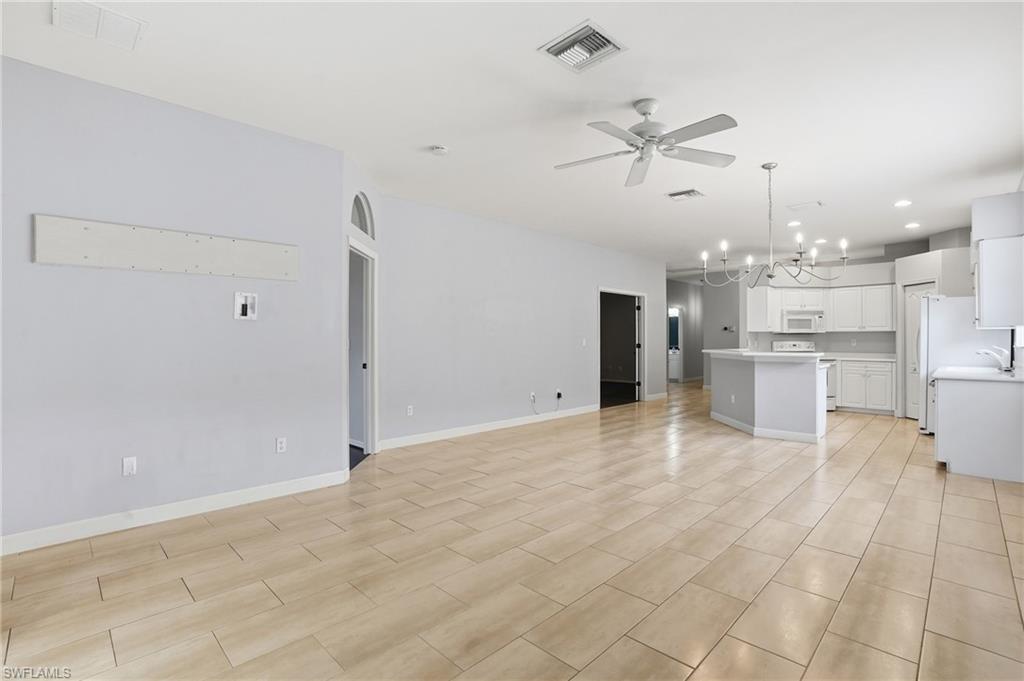 12517 Stone Valley Loop Fort Myers, FL 33913 - Photo 9 of 36 a view of a kitchen with a sink and microwave