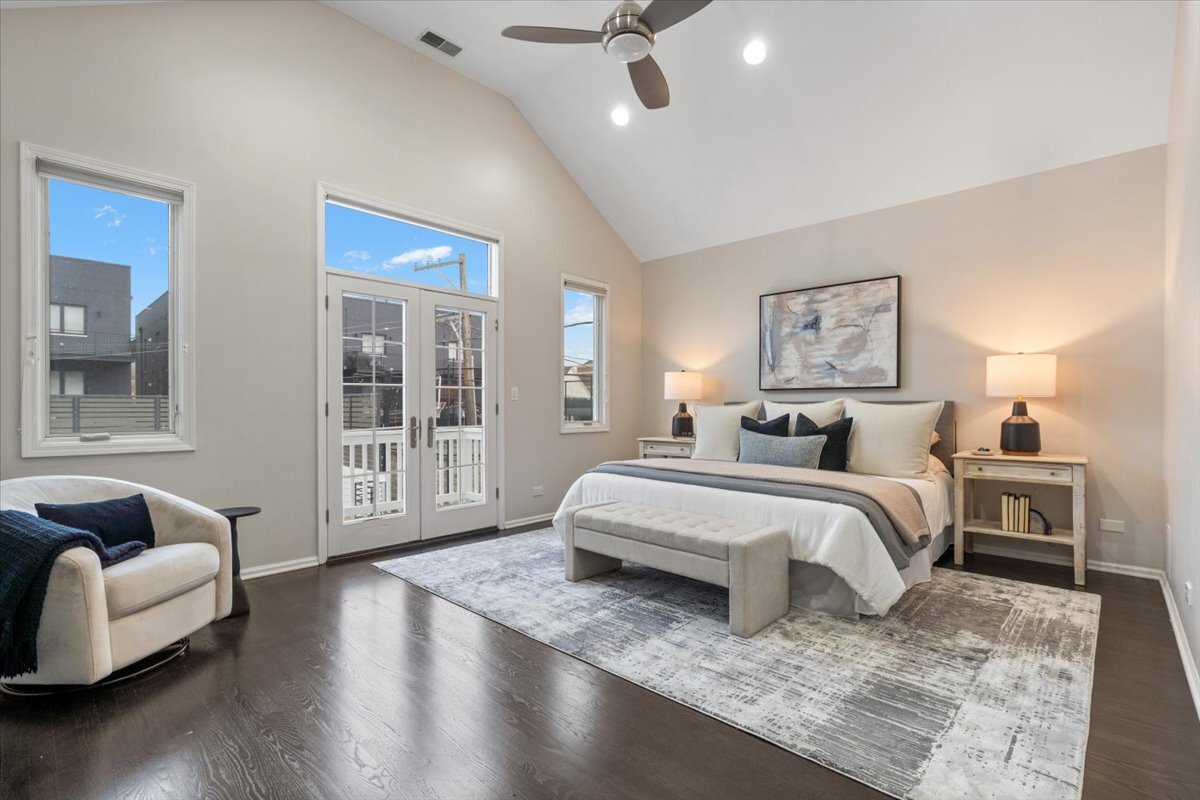 1937 West Melrose Street Chicago, IL 60657 - Photo 18 of 41 a spacious bedroom with a bed couch and a large window