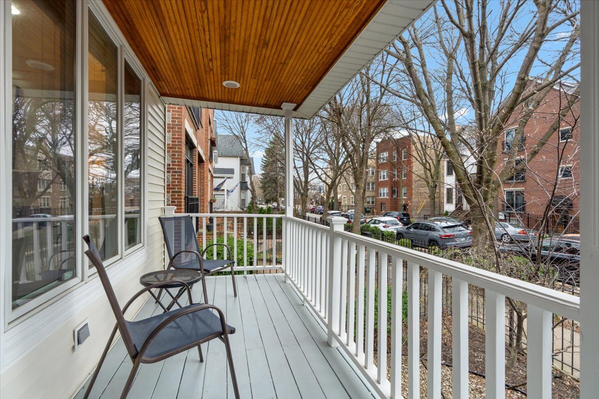 1937 West Melrose Street Chicago, IL 60657 - Photo 2 of 41 a view of a chairs on deck with wooden floor and fence