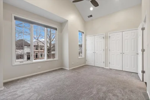 a bathroom with a granite countertop sink a toilet and shower