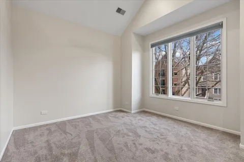 a bedroom with bed and window