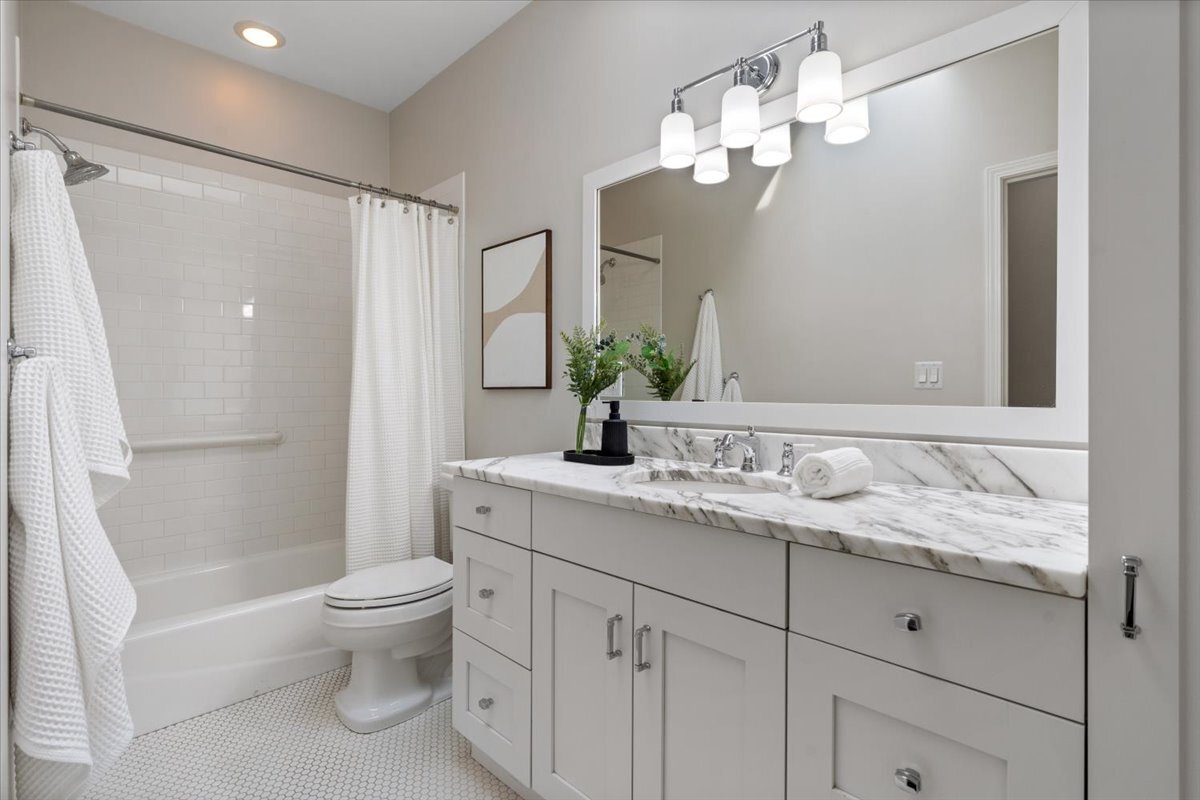 1937 West Melrose Street Chicago, IL 60657 - Photo 24 of 41 a bathroom with a granite countertop sink a toilet and shower