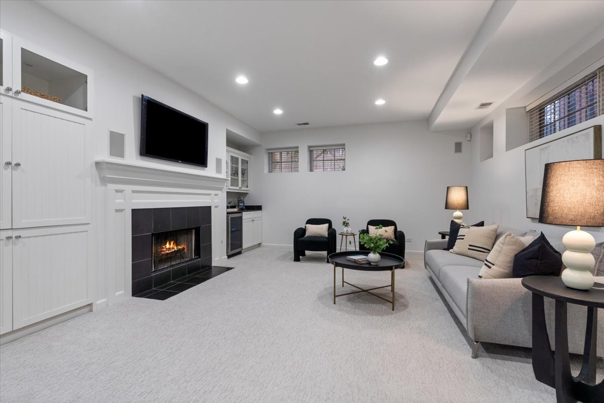 1937 West Melrose Street Chicago, IL 60657 - Photo 27 of 41 a living room with furniture and a fireplace